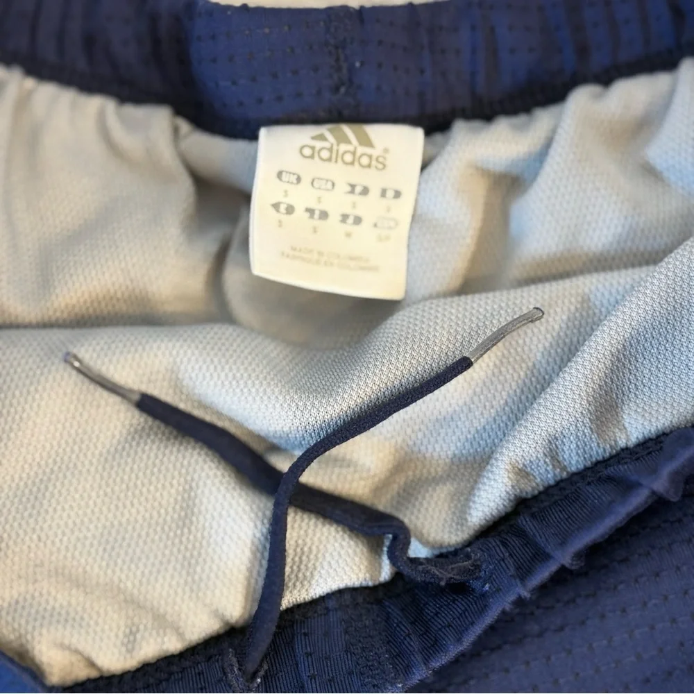 Adidas women's athletic climacool shorts size S. Navy blue with‎ purple stripes
